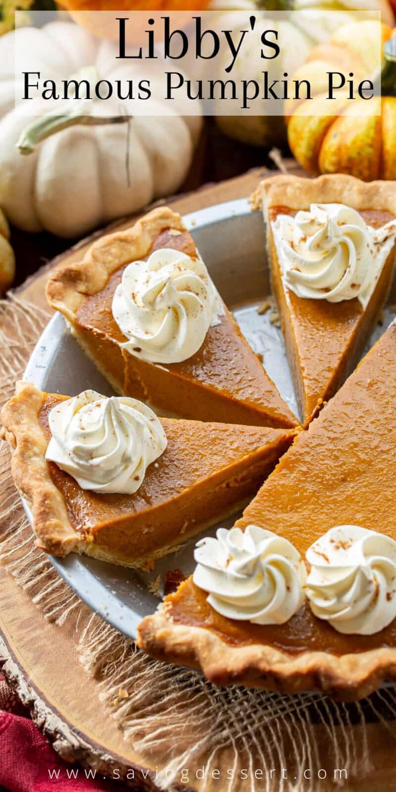 Libby's Famous Pumpkin Pie sliced in a pie pan and topped with swirls of whipped cream