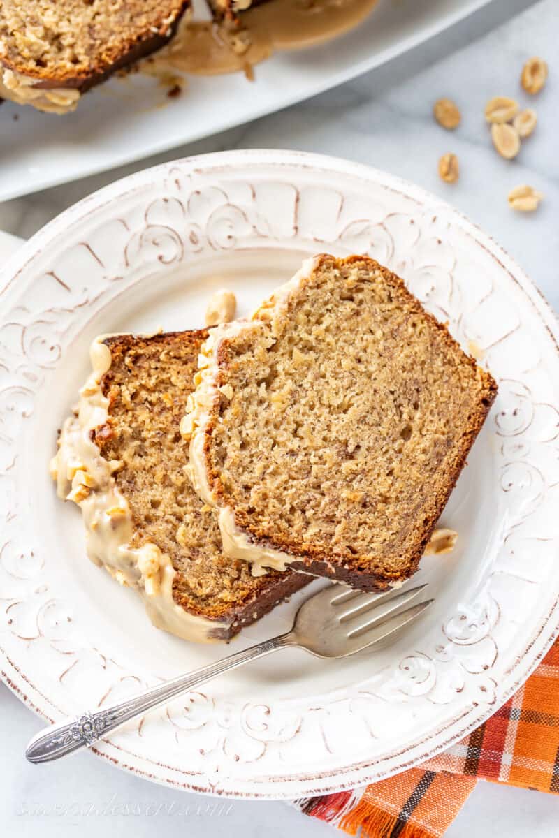 A plate with two slices of peanut butter banana bread