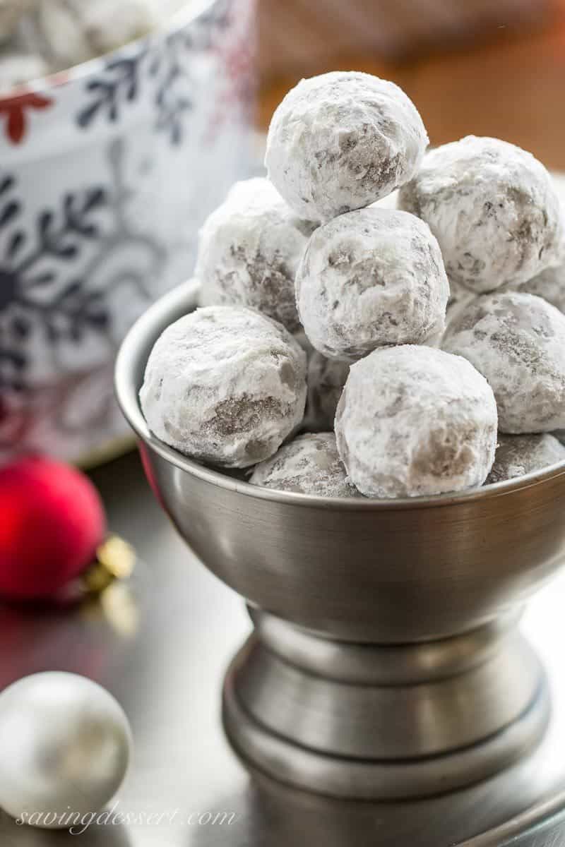 Bourbon Balls ~ an easy no-bake cookie that's been a family favorite for generations. Grab a bottle of your favorite bourbon or rum and mix up these delicious grownup holiday treats. www.savingdessert.com #savingroomfordessert #bourbon #bourbonballs #rumballs #nobakecookies #holidaytreats