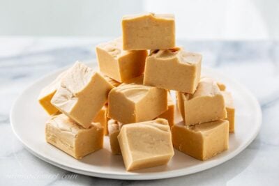 front view of stacked peanut butter fudge on a plate.