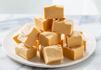 front view of stacked peanut butter fudge on a plate.