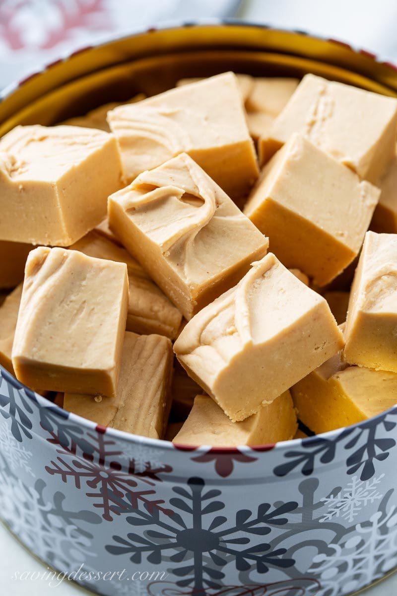 A Christmas tin filled with creamy peanut butter fudge