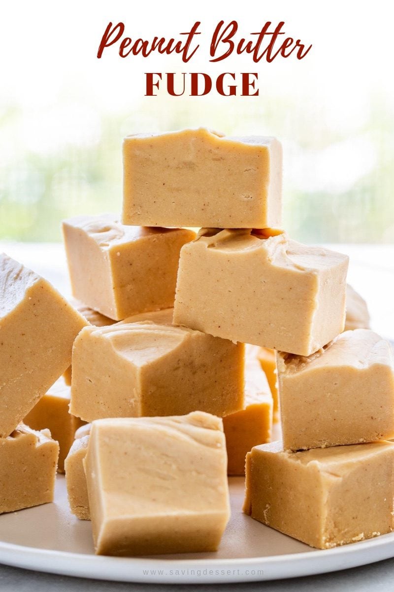 A plate of creamy peanut butter fudge cut into bite sized pieces