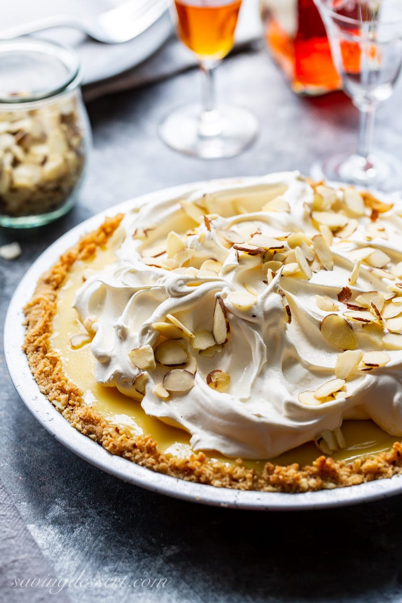 An Amaretto Cream Pie topped with whipped cream and sliced almonds