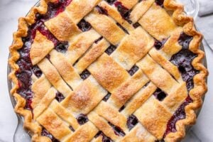 Overhead view of a lattice topped blueberry pie
