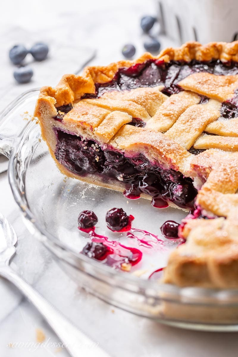 A side view of a sliced pie with a lattice top crust