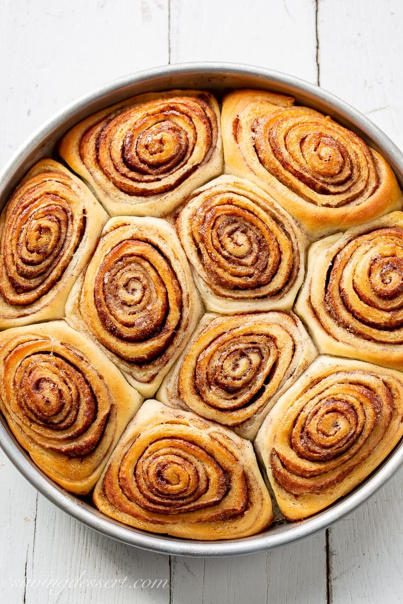 Close up of a pan of fresh from the oven cinnamon rolls
