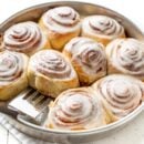 A pan of frosted cinnamon rolls