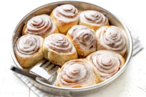 A pan of frosted cinnamon rolls