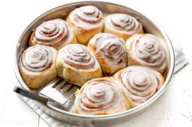 A pan of frosted cinnamon rolls
