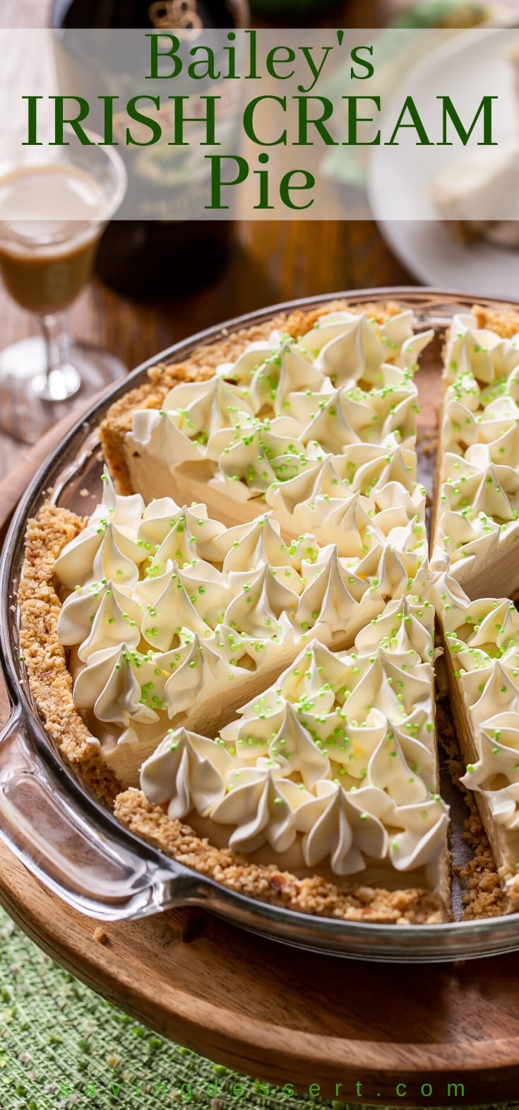 a sliced cream pie topped with whipped cream