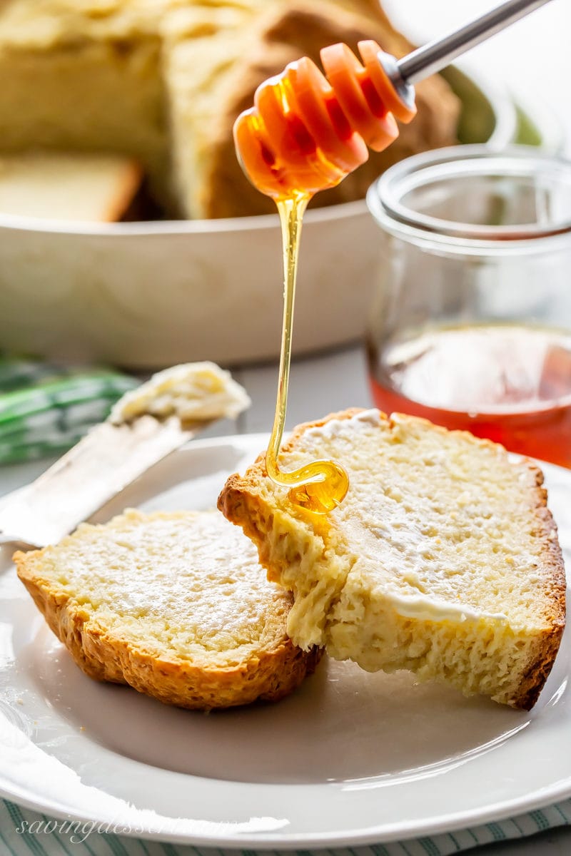 Sliced Irish Soda Bread with a drizzle of honey