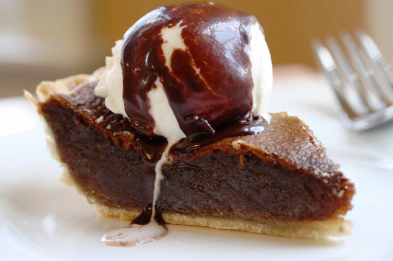 Fudge Pie with a wonderful texture, light chocolate flavor and a filling similar to pecan pie without the pecans! www.savingdessert.com