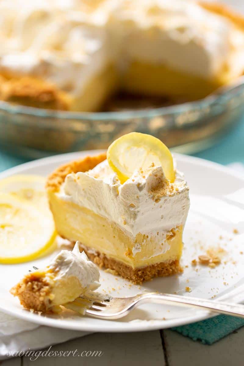 A slice of lemon icebox pie topped with whipped cream