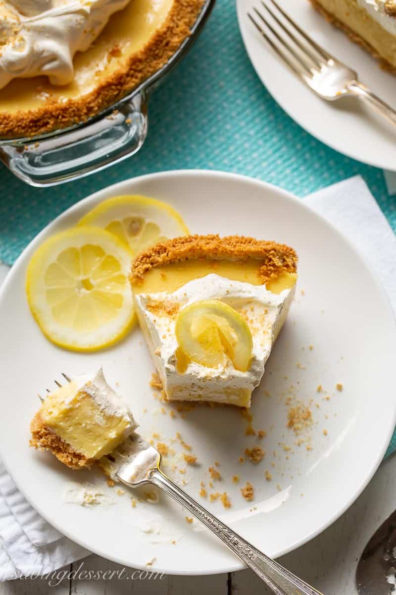 An overhead view of a slice of lemon icebox pie with a fork