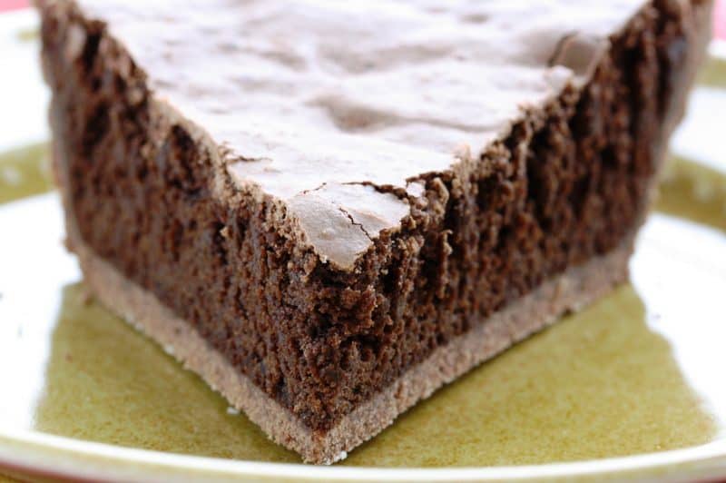 Mississippi Mud Pie - a deliciously light pie with a nice chocolate flavor, crunchy top and soft cake-light middle wrapped up in an easy chocolate crust www.savingdessert.com