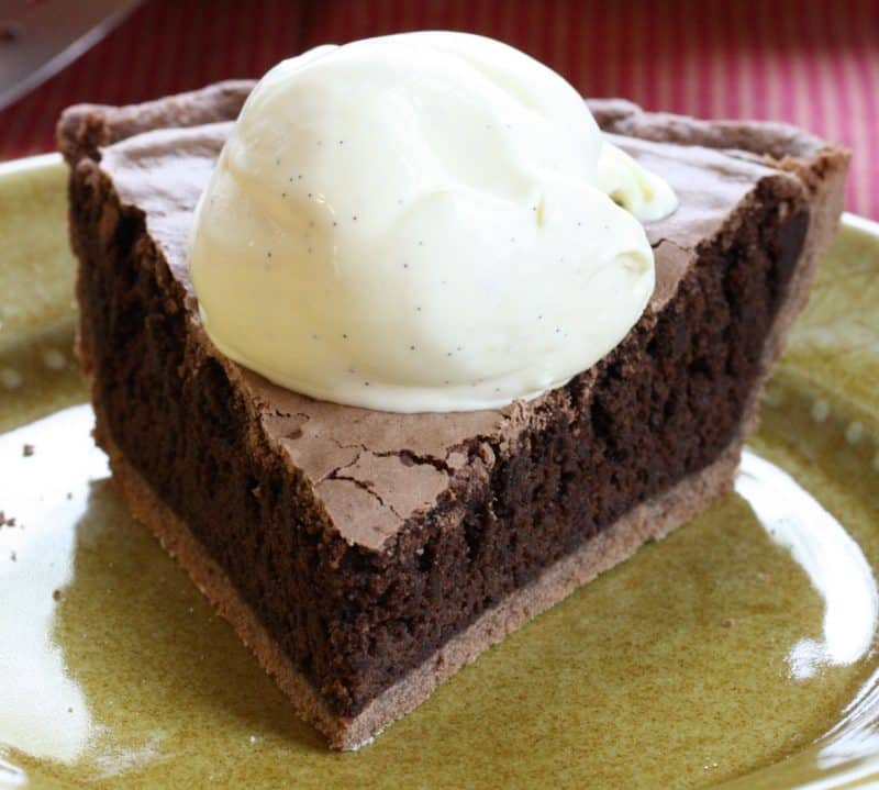 Mississippi Mud Pie - a deliciously light pie with a nice chocolate flavor, crunchy top and soft cake-light middle wrapped up in an easy chocolate crust www.savingdessert.com