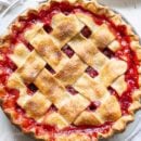 A closeup overhead view of a strawberry rhubarb pie