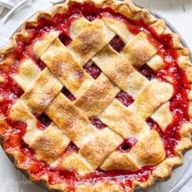 A closeup overhead view of a strawberry rhubarb pie