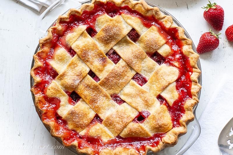 A closeup overhead view of a strawberry rhubarb pie