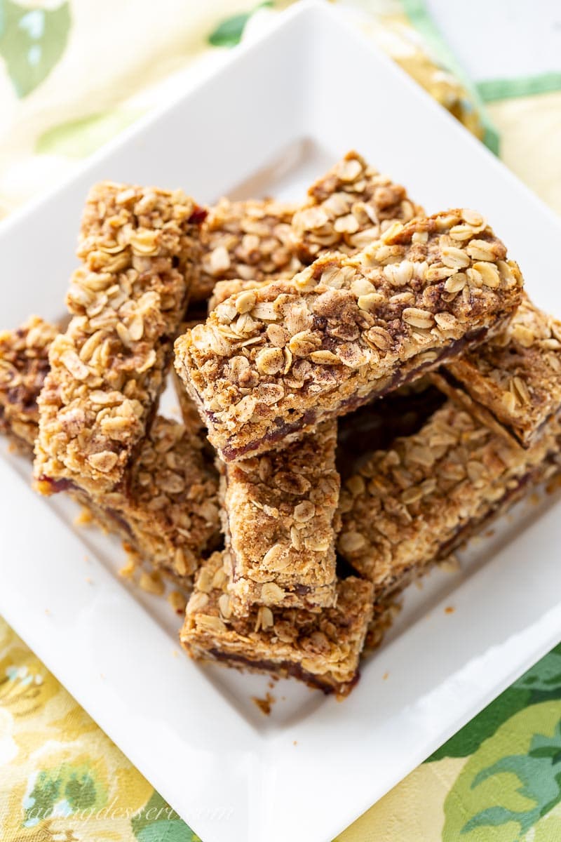 Overhead view of a plate of date bars topped with oats and cinnamon