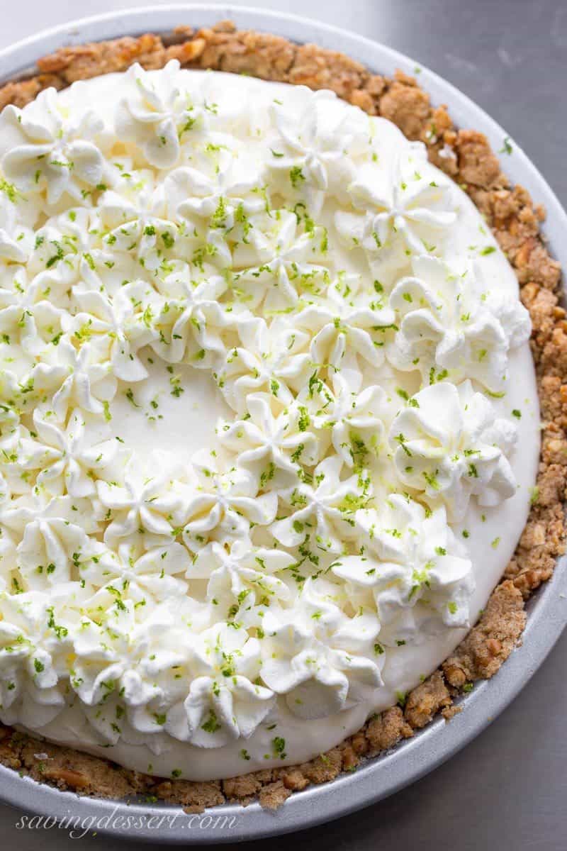 Frozen Margarita Pie with a Pretzel Crust ~ a wonderful light, creamy grown-up dessert that is incredibly easy to make with just a few tasty ingredients. Not too sweet, and not too boozy, this is a must make for all your summer parties! www.savingdessert.com