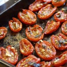 pan of sliced, seasoned and roasted grape tomatoes