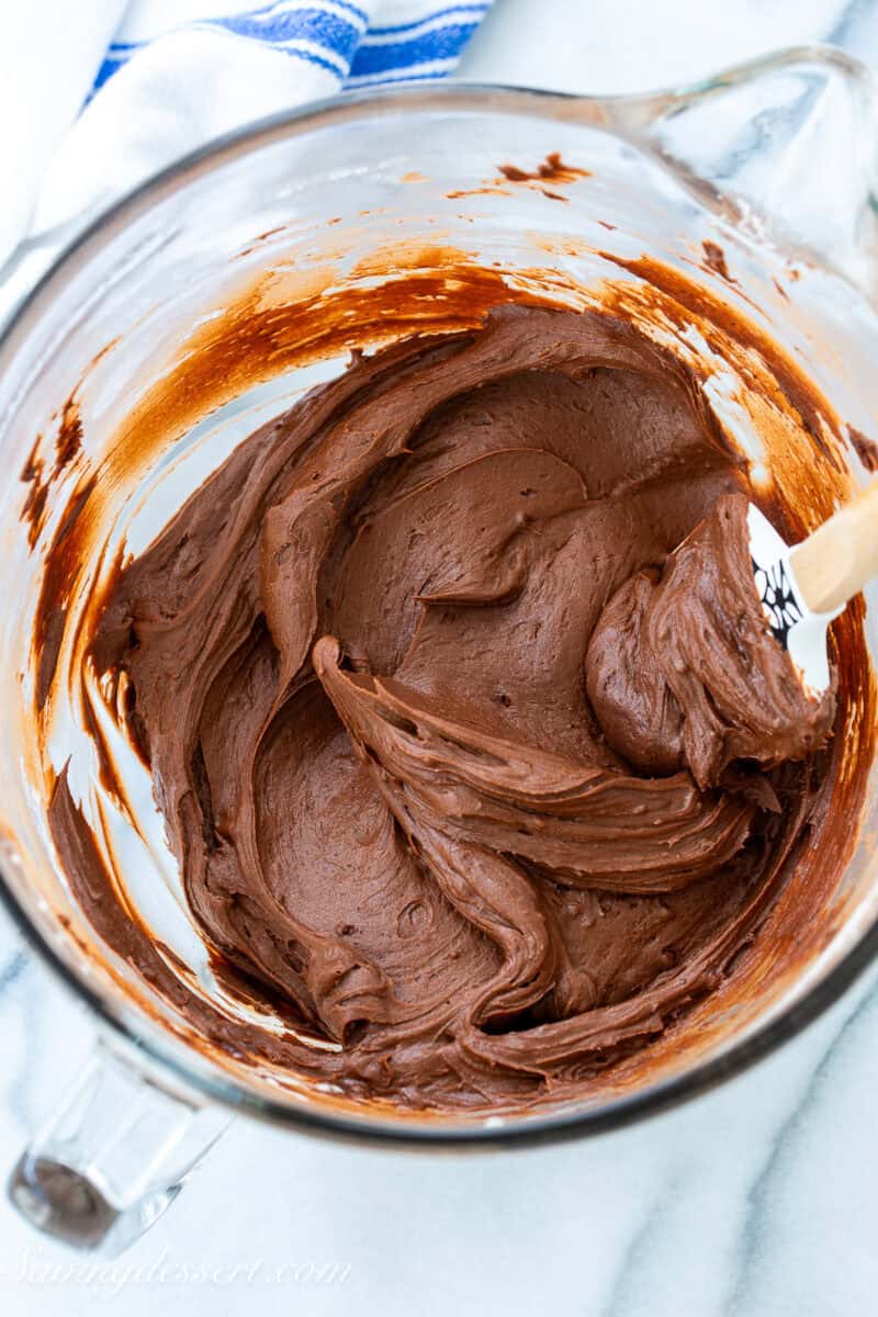 A bowl of dark chocolate icing.