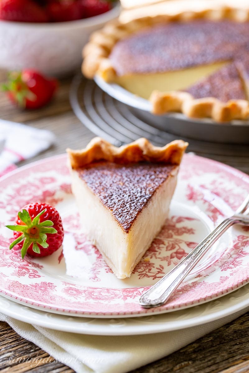 A slice of sugar pie served with a strawberry