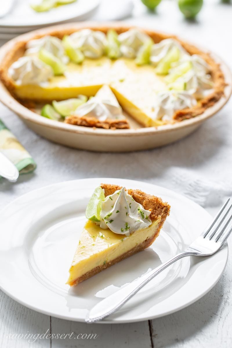 Sliced key lime pie on a plate with a fork