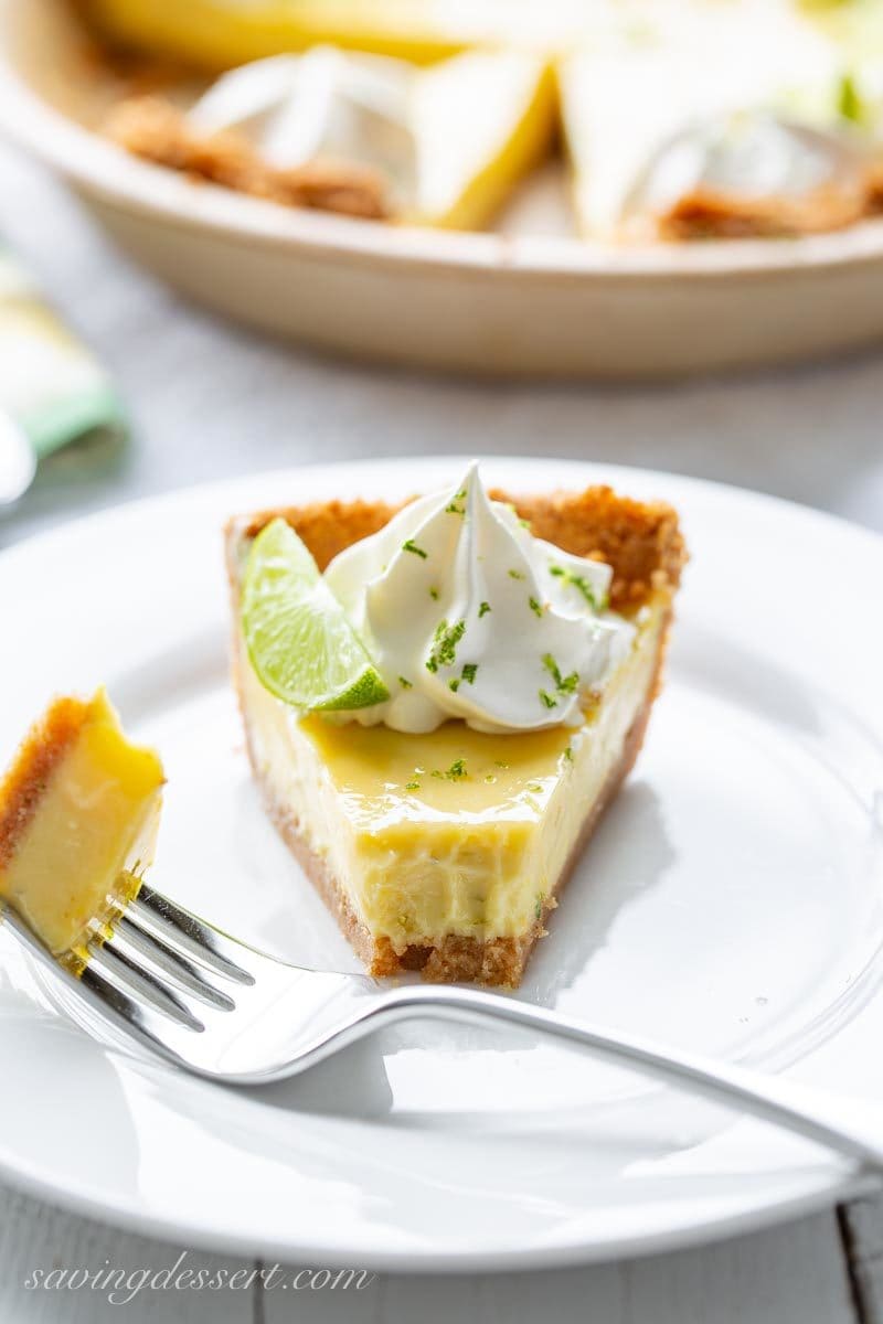 a slice of key lime pie with a bite on a fork
