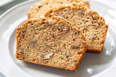 Three slices of zucchini bread on a plate