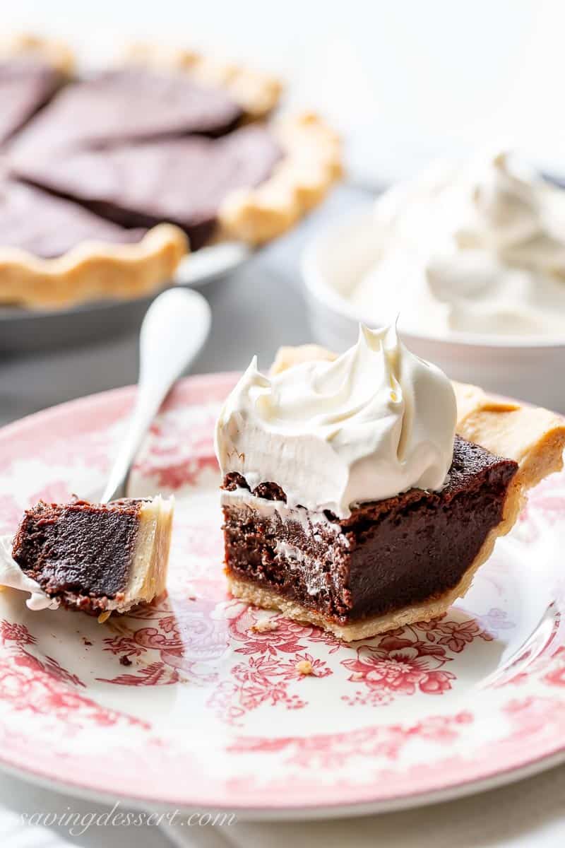 A partially eaten slice of chocolate pie on a plate