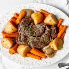 A slow cooker pot roast with potatoes and carrots