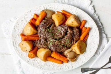 A slow cooker pot roast with potatoes and carrots