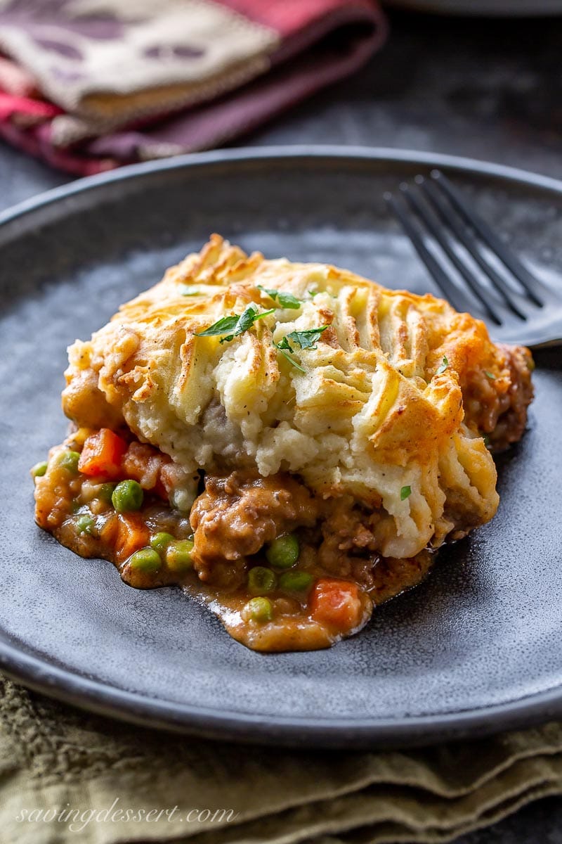 A hearty helping of cottage pie with beef, carrots, peas and mashed potatoes