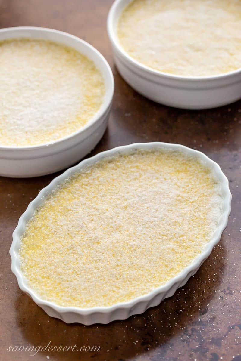 Three bowls of Crème Brûlée topped with granulated sugar
