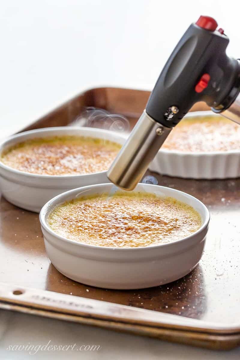 Crème Brûlée being torched to brown the sugar crust
