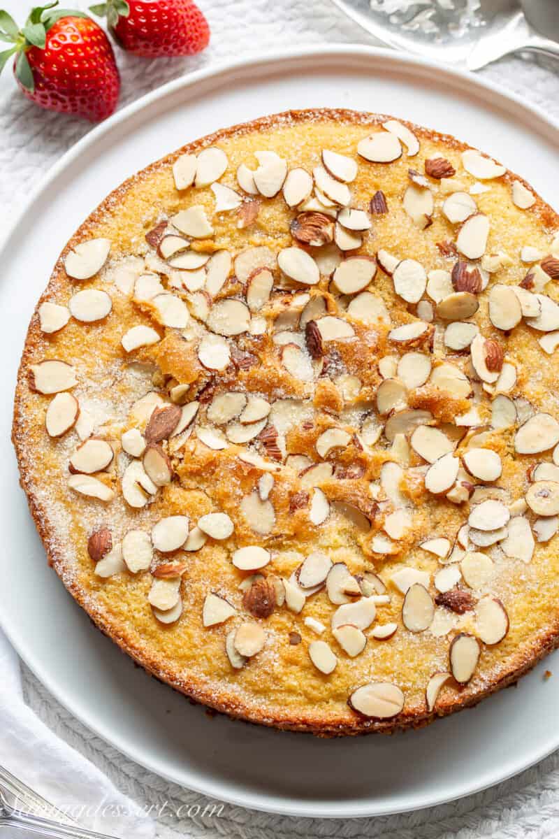 a single layer almond cake topped with almonds