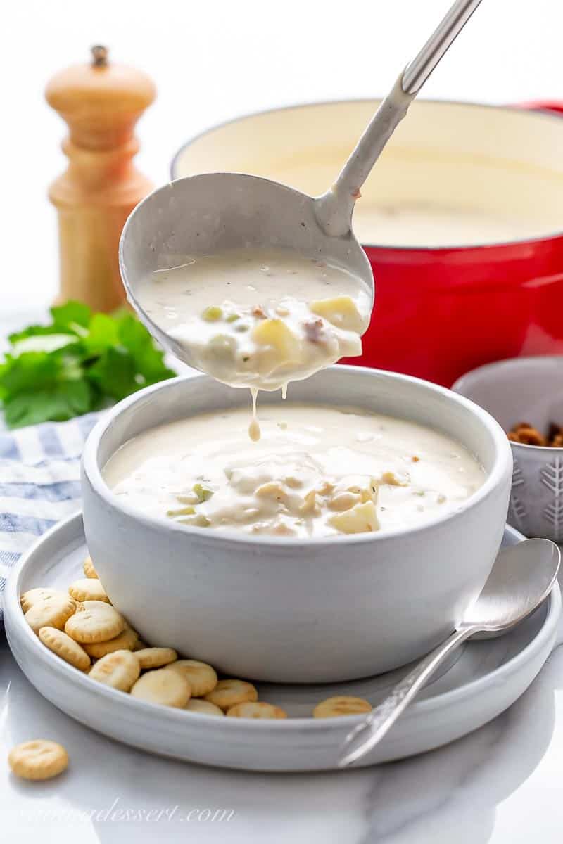 New England Clam Chowder being ladled in a bowl