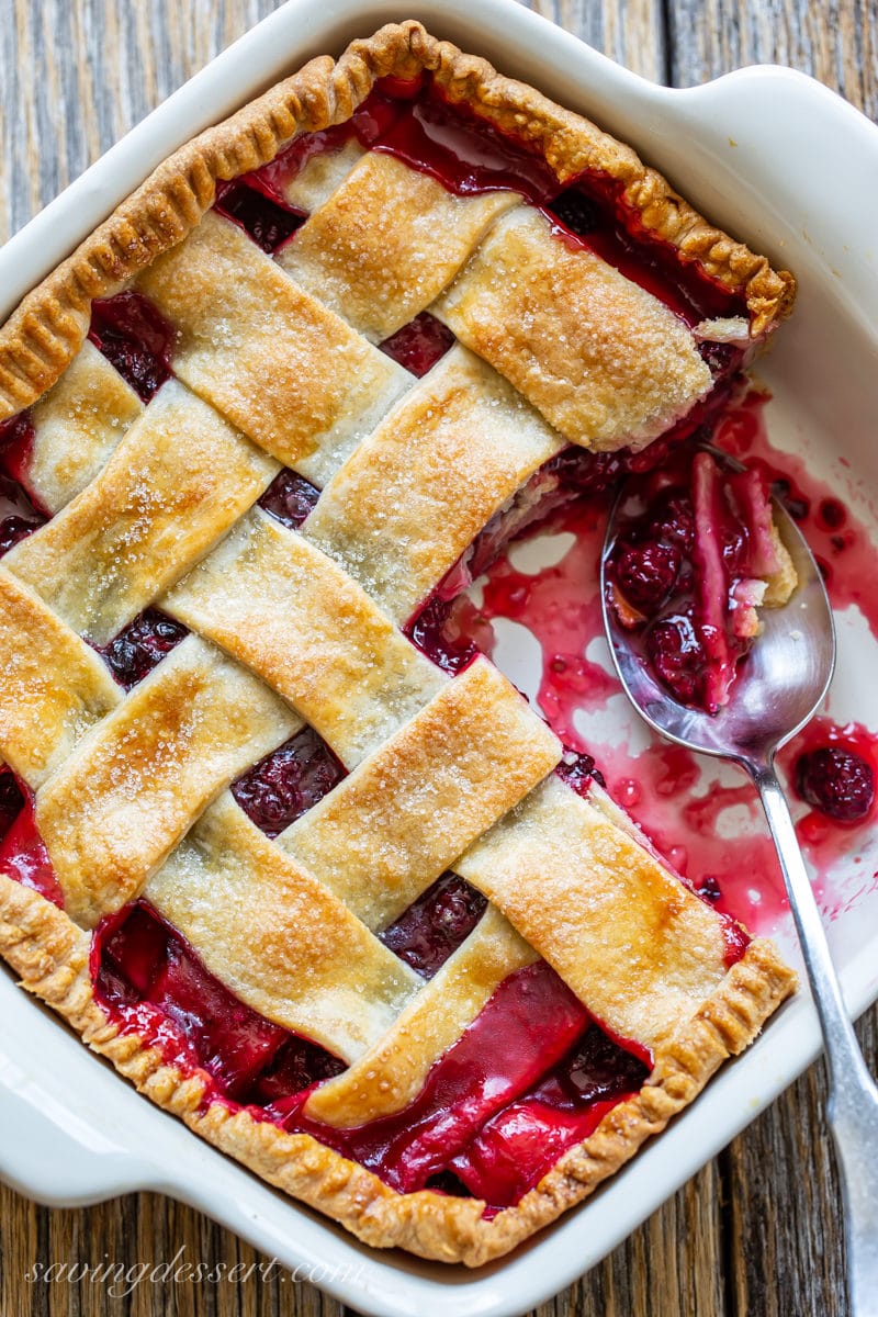 fashioned blackberry cobbler amongst a lattice transcend in addition to a bowl of fresh blackberries Old-Fashioned Blackberry Cobbler