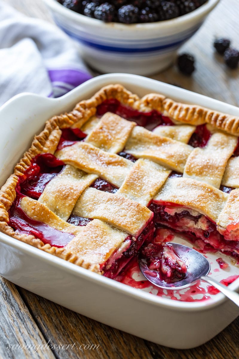 fashioned blackberry cobbler amongst a lattice transcend in addition to a bowl of fresh blackberries Old-Fashioned Blackberry Cobbler