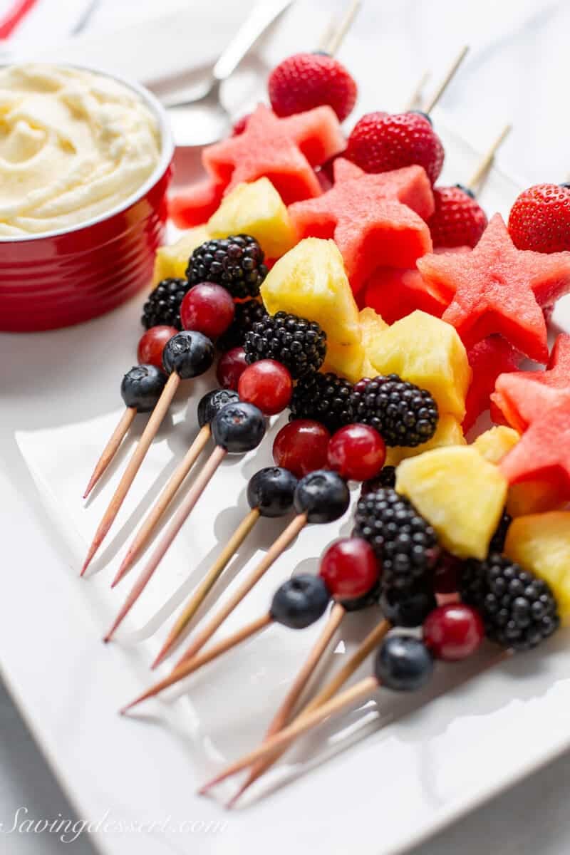 An overhead photo of fruit platter with dip on the side.