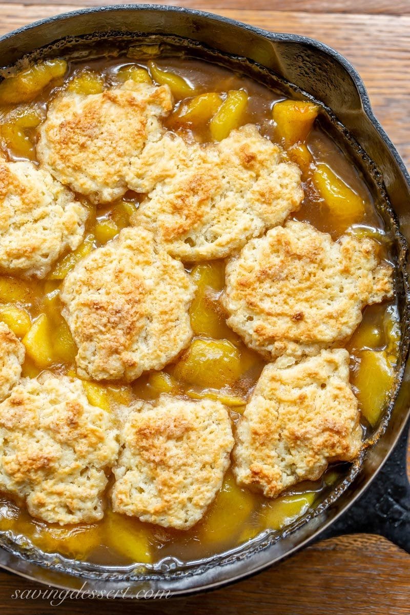 Old fashioned skillet peach cobbler with a shortcake biscuit crust