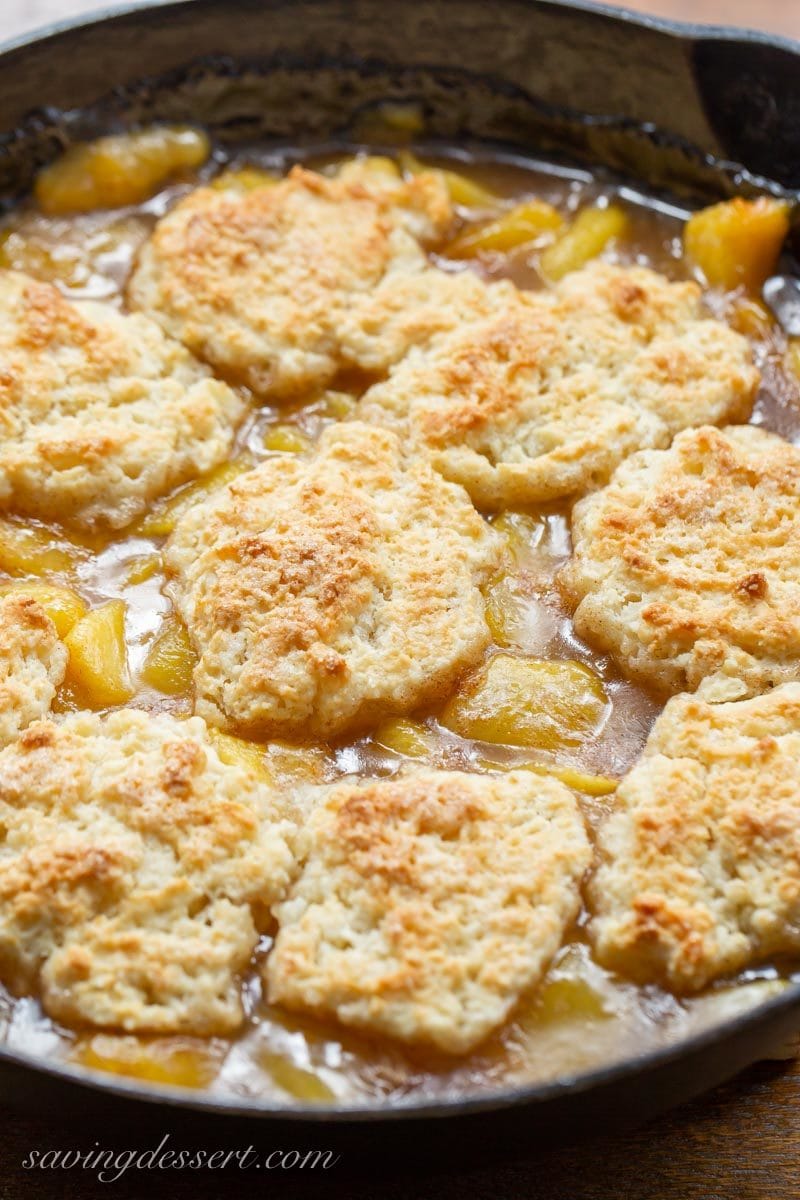 Old fashioned skillet peach cobbler with a shortcake biscuit crust