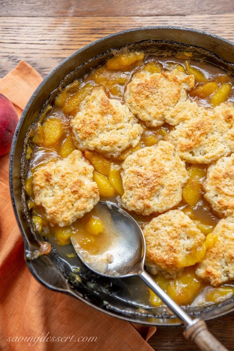 Old fashioned skillet peach cobbler with a shortcake biscuit crust
