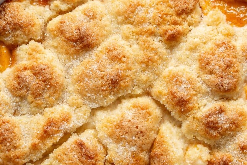 Peach cobbler with a shortcrust biscuit topping.