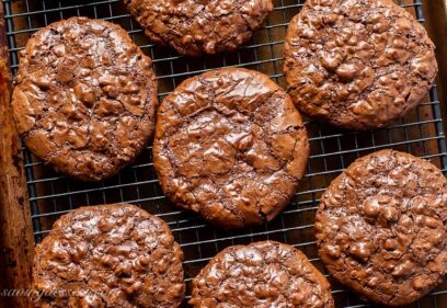 Overhead view of a cooling rack filled with chocolate cookies