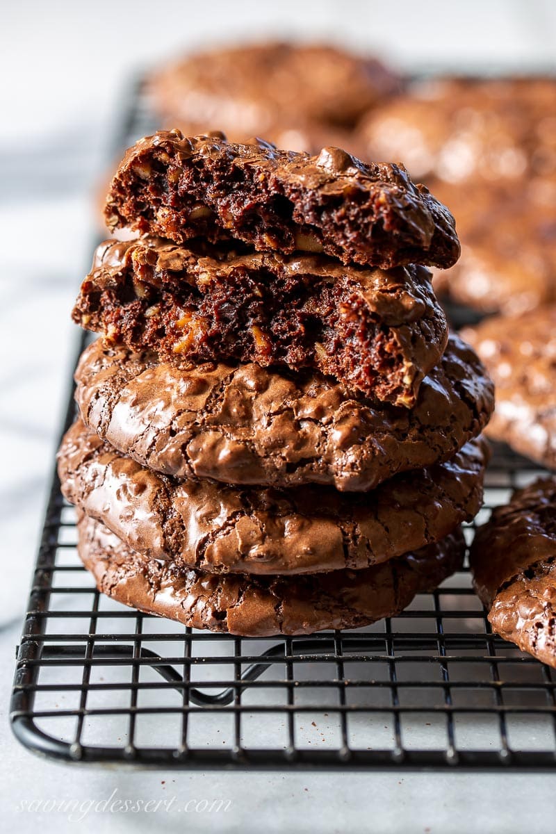 Side view of a stack of chocolate cookies with walnuts