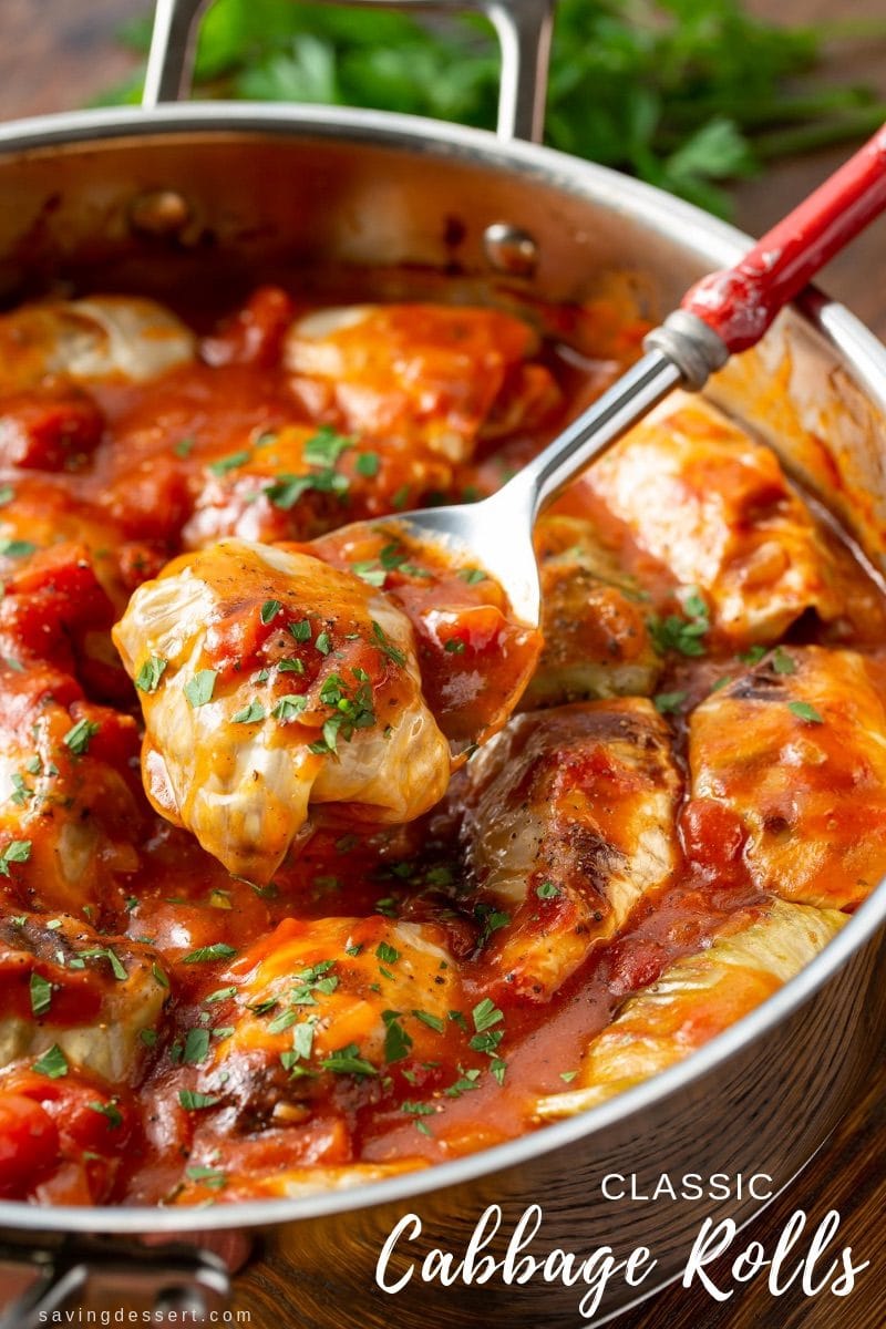 Classic Cabbage Rolls Recipe - with tender cabbage leaves stuffed with rice, seasoned ground beef and caramelized onions simmered in a rich tomato sauce that's a little sweet and a just a tad sour, for a lovely complex flavor and mild bite. #savingroomfordessert #cabbagerolls #classiccabbagerolls #cabbagerollsrecipe #groundbeef #cabbage #tomatosauce #dinner #comfortfood